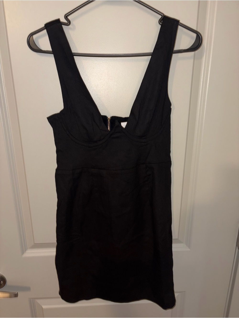 Sleek Black Mini Dress with Deep V Neck